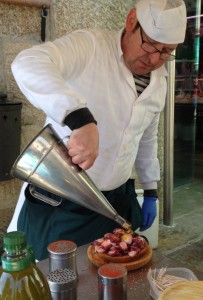 The father figure of our octopus cooking team. In his hand is the olive oil can and the paprika shakers are nearby.
