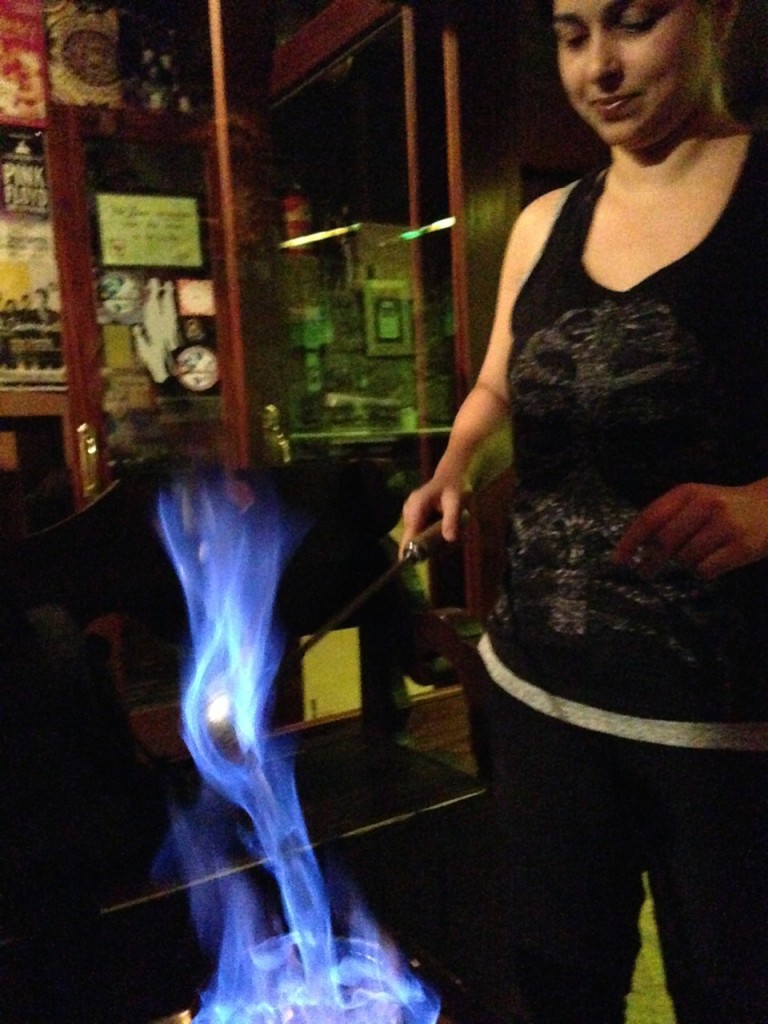 Our Galician spell caster ladles the queimada and pours it back in to the flaming bowl.