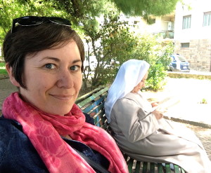 Alison and a nun at a bus stop in Sassari, Sardinia.