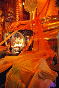 Golden Cloth Covers Worshipers at Wat Phanan Choeng