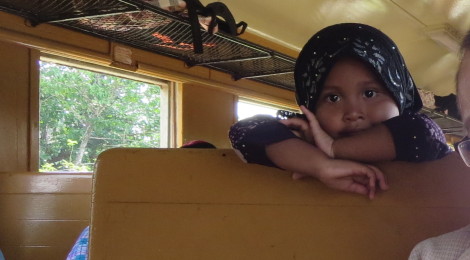 A Girl Wears Hijab on a Train In Southern Thailand